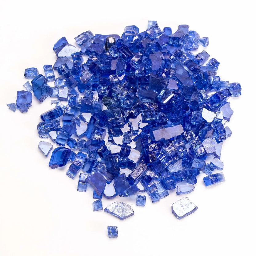 Vibrant cobalt blue fire glass pieces piled together, showing deep, rich blue tones with a glossy finish. The angular shapes and translucent quality create a striking visual effect, ideal for bold, eye-catching fire pit installations.