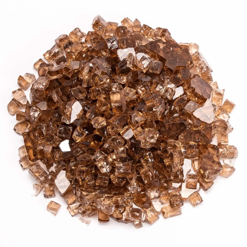 Copper-toned tempered fire glass displayed in a dense pile, featuring warm amber hues with subtle variations in color. The reflective surfaces enhance the glow of flames, adding a luxurious and inviting ambiance to outdoor or indoor fire features.