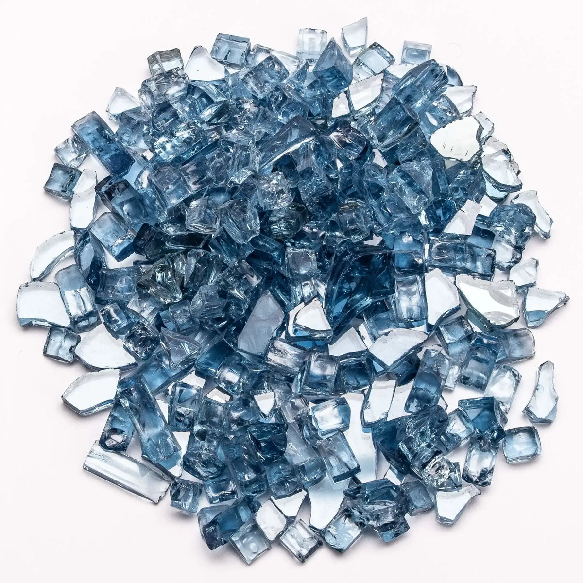 Pacific blue tempered fire glass with a softer, ocean-inspired tone compared to cobalt. The semi-translucent pieces reflect light beautifully, creating a calming, cool aesthetic perfect for modern fire pits and outdoor living spaces.