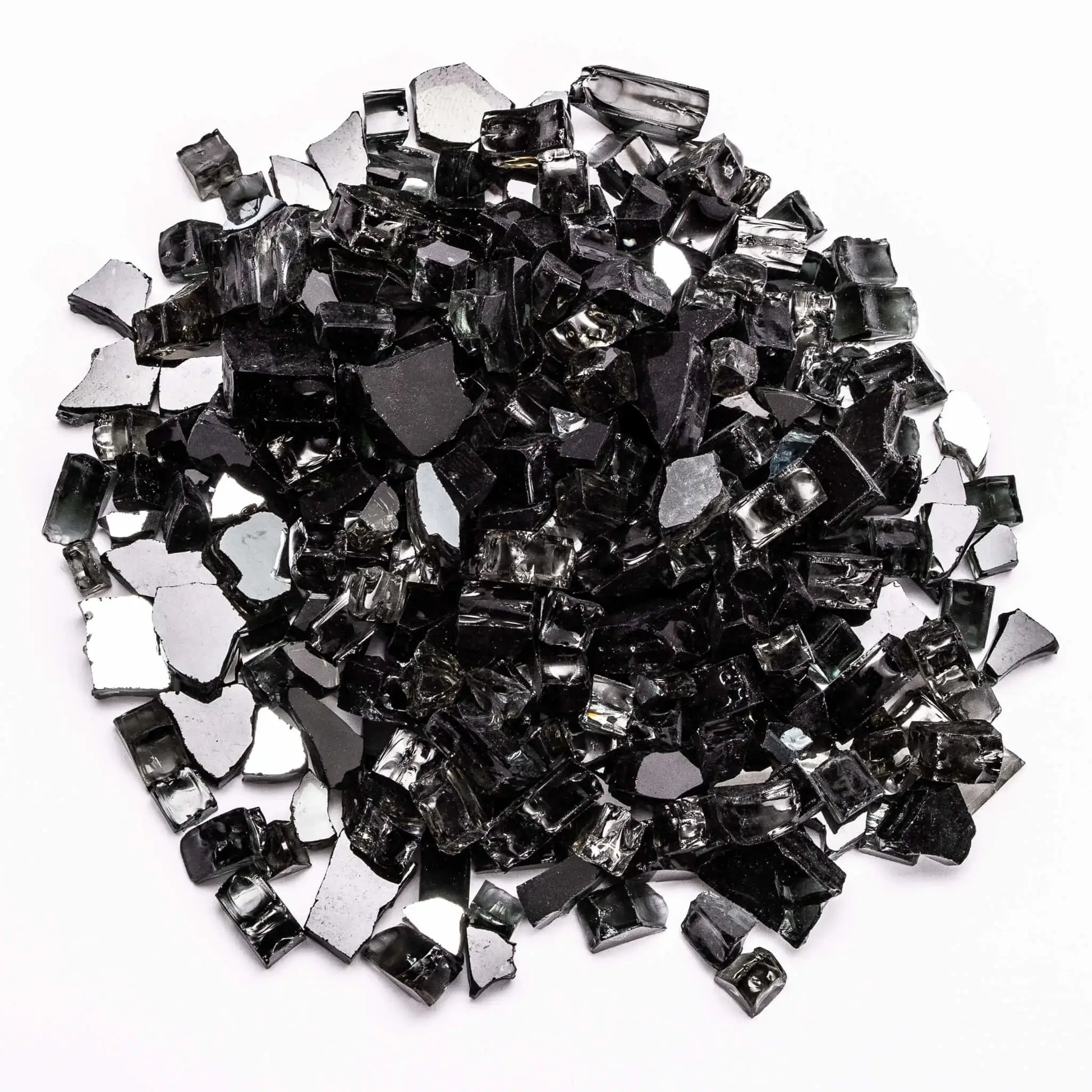 Close-up of reflective black tempered fire glass pieces scattered in a mound on a white background. The sharp-edged fragments feature a glossy finish with mirror-like backing, creating depth and shimmer. Perfect for contemporary fire pits or fireplaces where a bold, sleek, and dramatic flame presentation is desired.