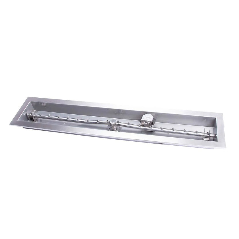 Close-up product image of a stainless steel linear trough fire pit pan paired with a torpedo-style T burner, showing gas inlet connection, burner ports, and integrated ignition components. The polished metal finish highlights the durable 304 stainless steel construction designed for custom fire pit builds.