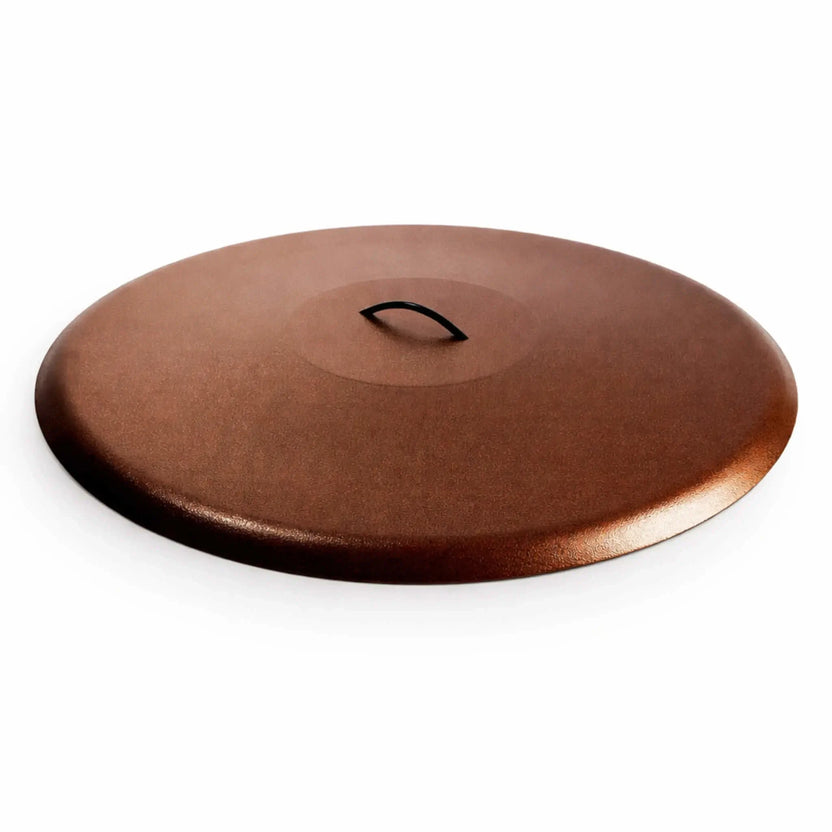 Round aluminum fire pit burner cover in a rich copper vein finish, designed with a low domed profile and a softly textured metallic surface. The recessed center includes a curved black handle for convenient removal. Set against a white background, the warm bronze tones and subtle speckled finish emphasize its stylish, weather-resistant design for outdoor fire features.