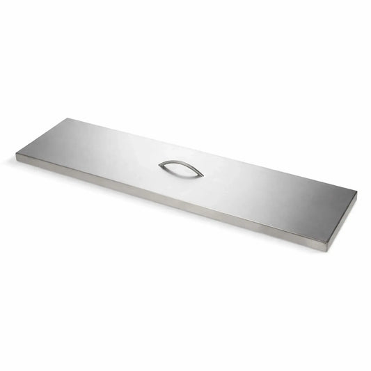 A long, rectangular stainless steel burner cover with a smooth brushed finish is shown at a slight angle on a clean white background. The cover features a low-profile, curved handle centered on top for easy lifting. Its sleek, linear design and sharp edges highlight a modern, durable construction ideal for protecting outdoor fire pit burners when not in use.