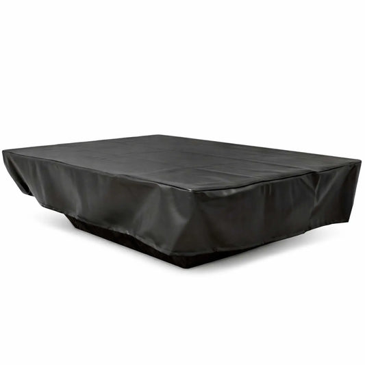 Black rectangular vinyl fire pit cover shown at an angled perspective on a clean white background, designed to protect a large outdoor fire pit or table. The cover features a smooth, slightly matte finish with natural creases and folds along the top surface and draped sides. Reinforced seams and tailored edges create a snug fit, while the extended skirt provides full coverage down to the base, indicating durable, weather-resistant construction for outdoor use.