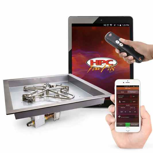 HPC Fire Inspired Hearth Products controls square drop-in electronic ignition hi lo low torpedo penta burner presented on a white background with integrated smart controls. The stainless steel burner pan with torpedo-style penta burner is paired with a tablet showing the HPC Fire Pits app, plus a handheld remote and smartphone, demonstrating convenient wireless control, ignition settings, and flame height adjustment for modern outdoor fire features.