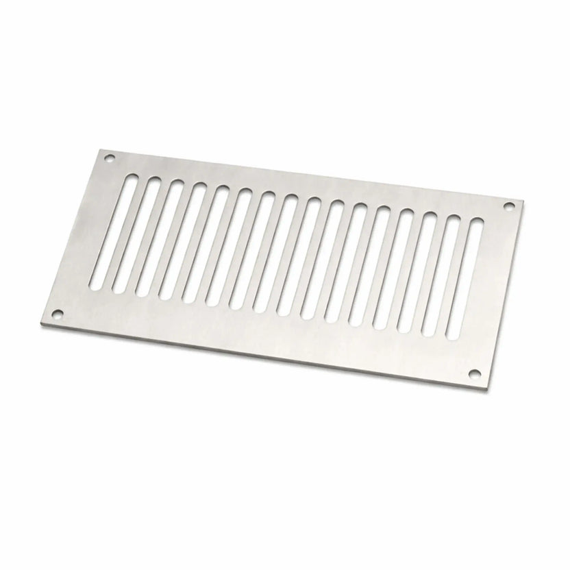 Stainless steel fire pit enclosure vent panel with elongated ventilation slots and four mounting holes. This rectangular HPC fire pit vent is designed to be installed in fire pit enclosures to allow proper airflow and gas ventilation for propane or natural gas fire pits, helping prevent gas buildup inside the fire pit structure.