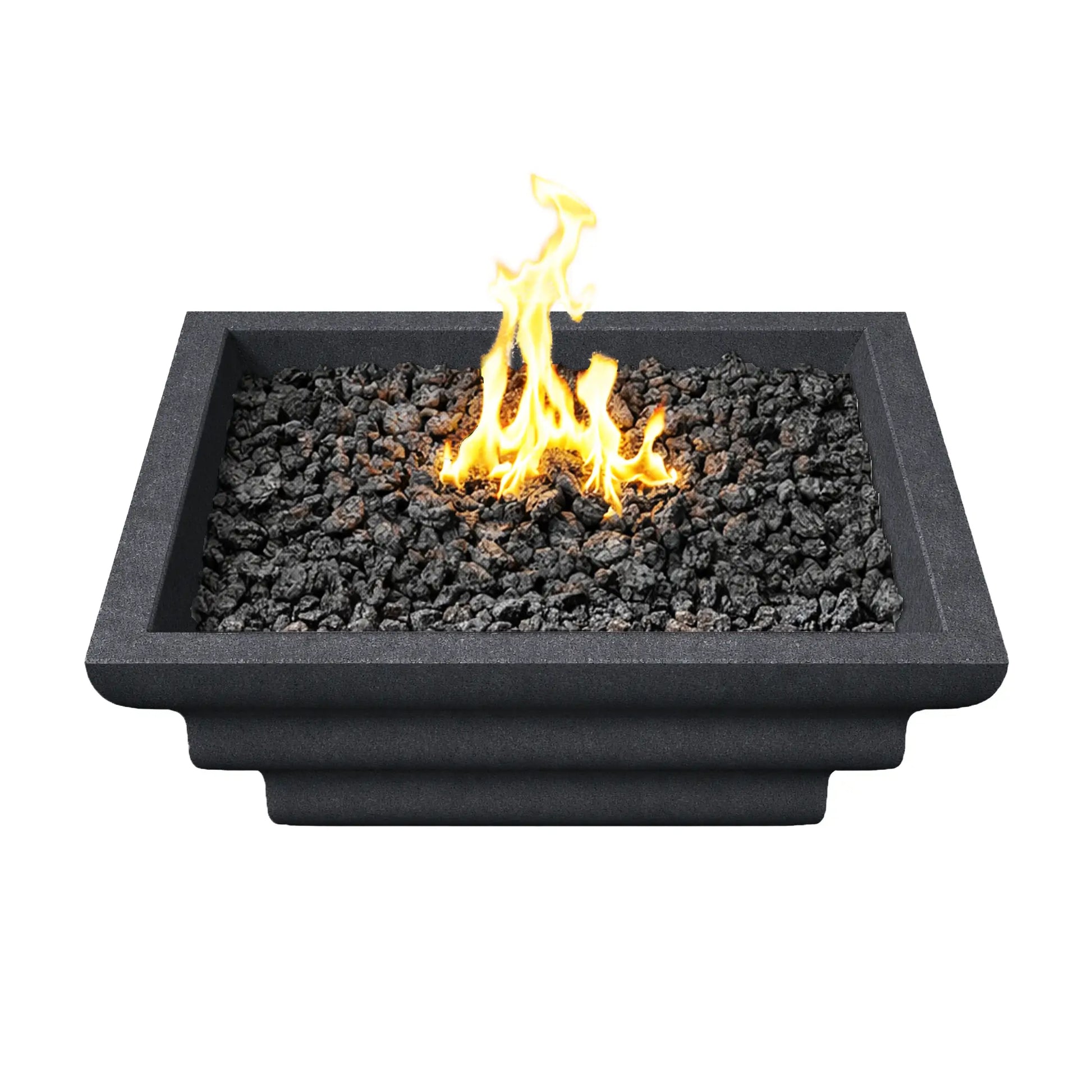 Top-down view of the black Shadow Cast Ripple Designer Series fire bowl filled with black lava rock media. A bright yellow gas flame rises from the center of the burner, surrounded by evenly distributed fire rock. The square architectural fire bowl features a thick rim and modern geometric profile designed for outdoor patios and poolside fire features.