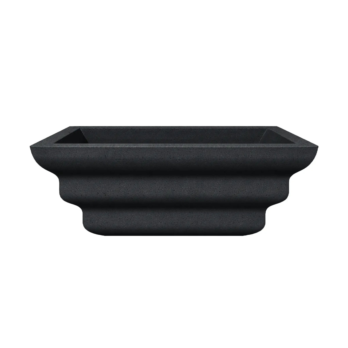 Side profile view of the black Shadow Cast Ripple Designer Series fire bowl with an empty basin. The sculpted ripple-style exterior creates layered curves that give the bowl a distinctive architectural look. The square rim and tapered base highlight the bowl’s modern outdoor fire feature design.