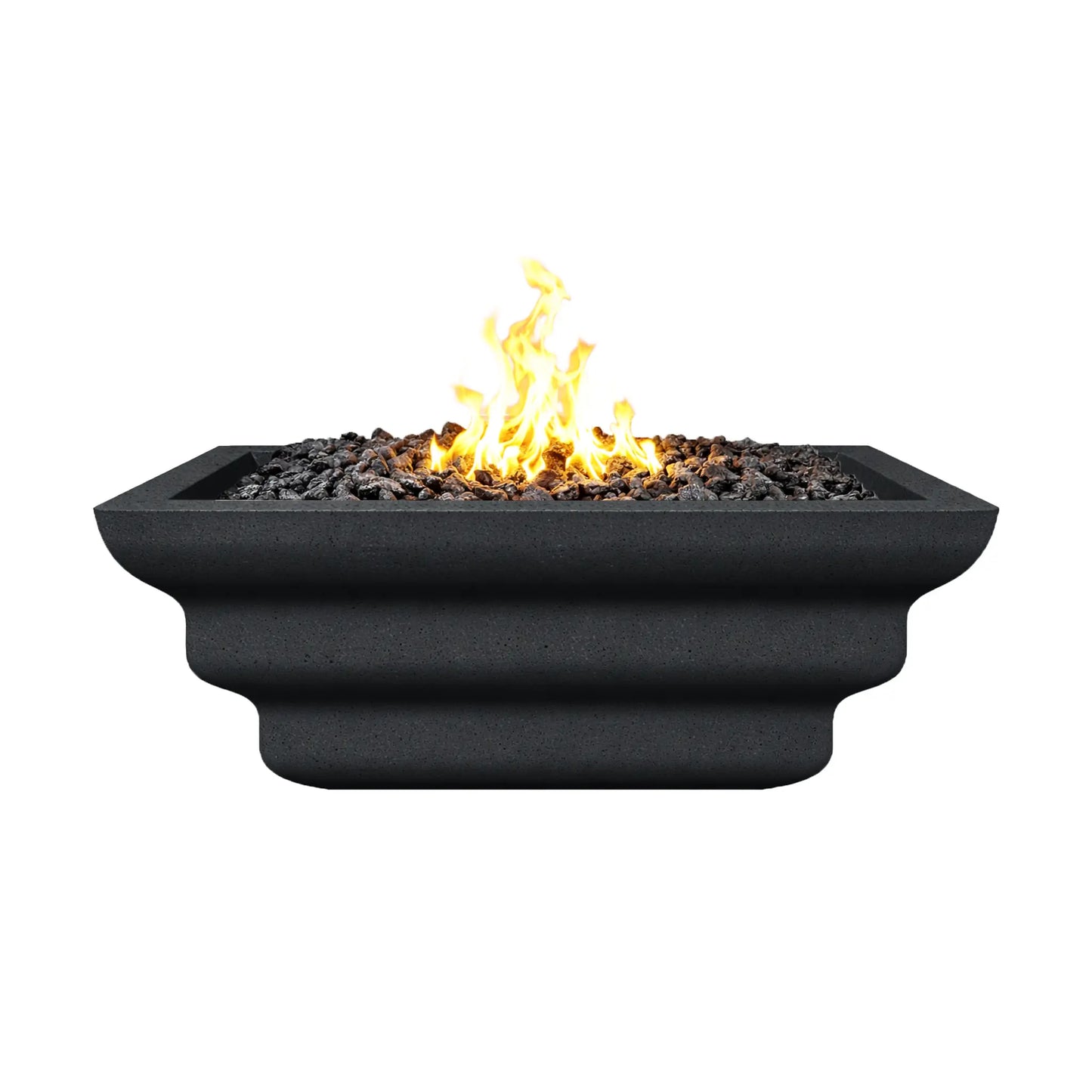 Side elevation view of the black Shadow Cast Ripple Designer Series fire bowl burning with a bright gas flame above black lava rock media. The layered ripple pattern along the exterior is clearly visible, giving the square fire bowl a sculpted architectural look suitable for luxury outdoor fire pit installations.