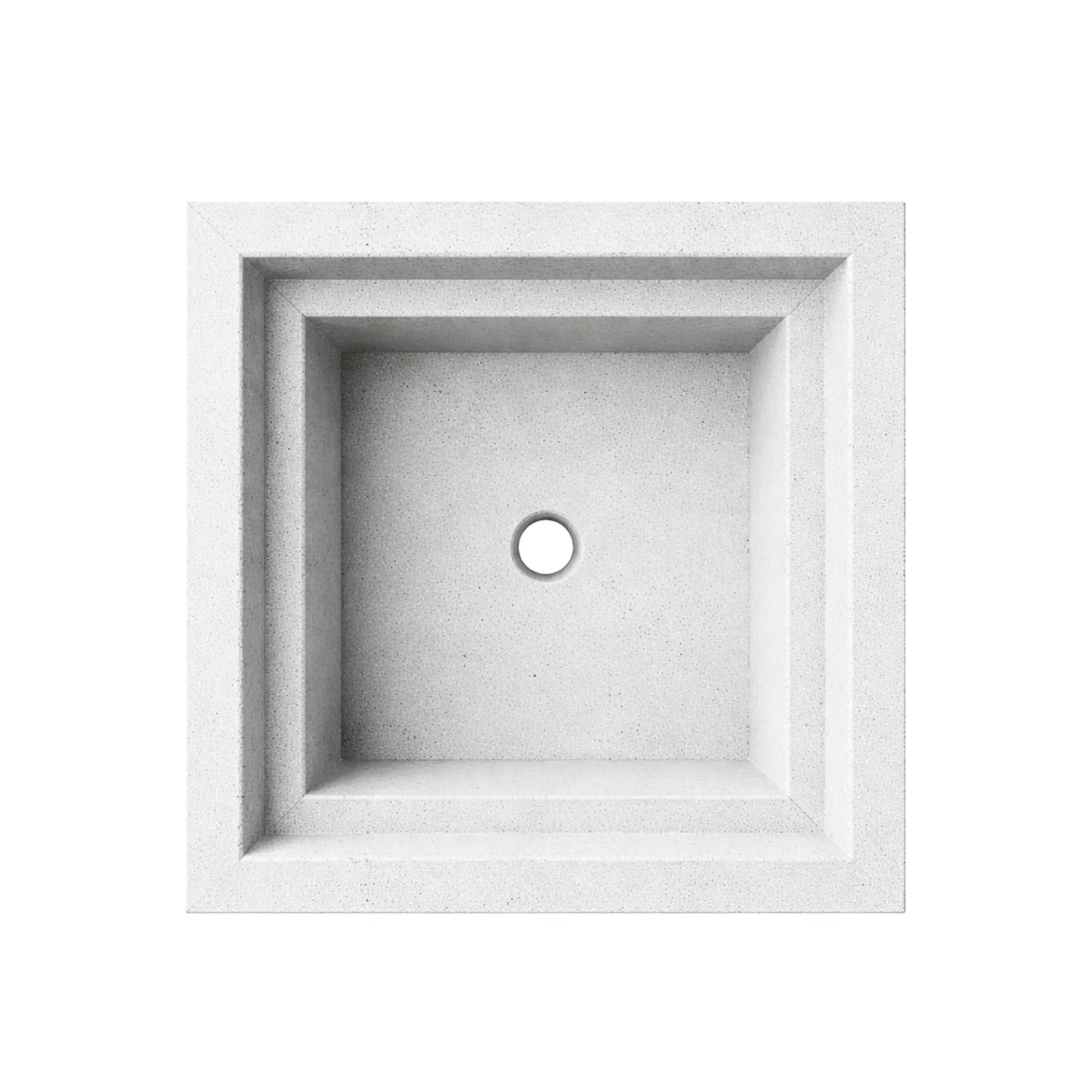Top view of the white Shadow Cast Ripple Designer Series fire bowl with the basin empty and no burner installed. The recessed square chamber features a centered circular gas inlet hole and stepped interior ledges. The textured white concrete-style finish highlights the clean geometry and architectural form of the fire bowl.