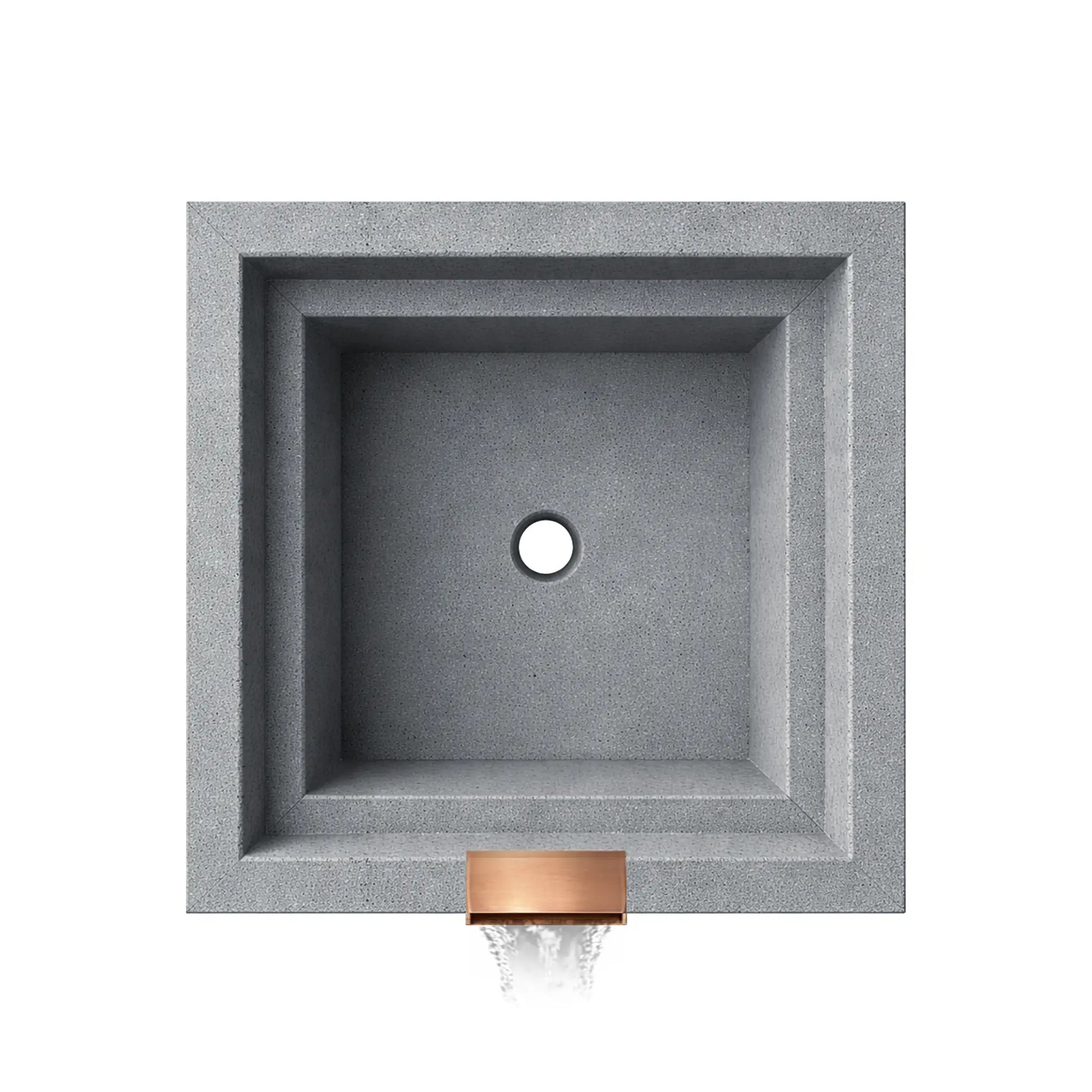 Direct overhead view of an empty gray Shadow Cast Ripple fire and water bowl. The square basin shows the centered drain opening at the bottom along with smooth interior walls. A copper waterfall spillway sits at the front edge where water exits the bowl, highlighting the internal layout before fire components are installed.