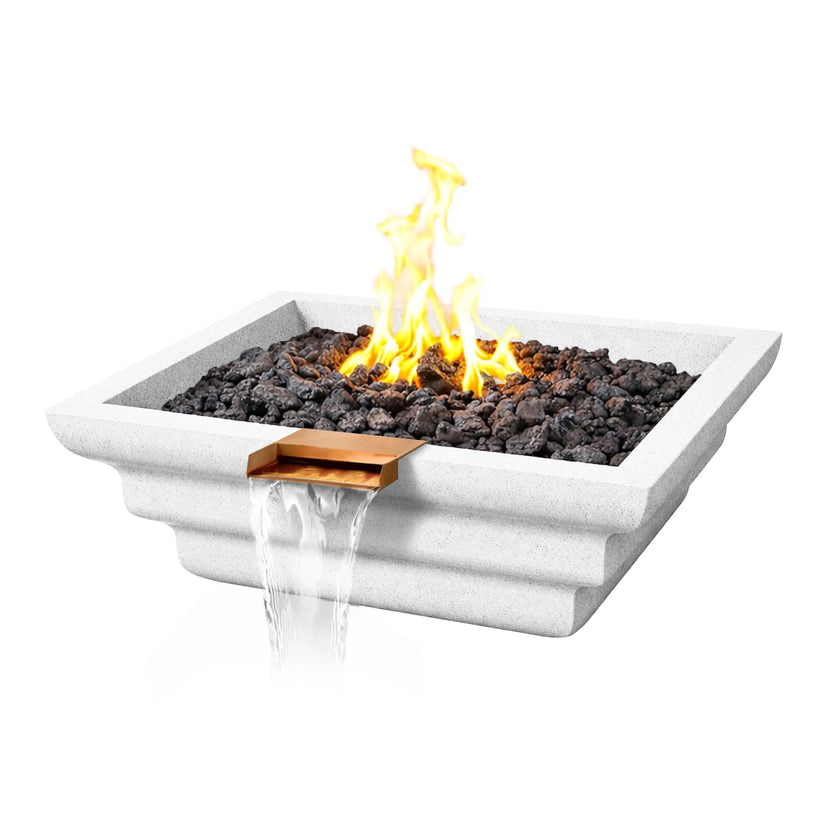 Angled product image of a white Shadow Cast Ripple Designer Series fire and water bowl featuring a bright yellow gas flame burning above black lava rock. Water flows from the copper waterfall spillway at the front of the square GFRC concrete bowl, highlighting the modern fire and water feature design.