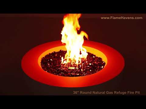 Close-up video of the 36" Round GFRC (Glass Fiber Reinforced Concrete) Natural Gas Fire Pit by Flame Havens Refuge Series burning with vibrant flames over black reflective tempered fire glass. The video showcases all three available finish colors, while demonstrating the optional tempered glass wind guard in use during operation and the optional stainless steel burner cover for a clean tabletop appearance when the fire pit is not in use. Designed for luxury outdoor living spaces, and patios. 