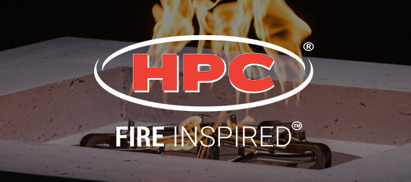 A close-up promotional photo of a fire starter or flame-related product with visible flames rising above a surface. Large overlaid text reads 'HPC' in red inside an oval, with 'FIRE INSPIRED' below in white.