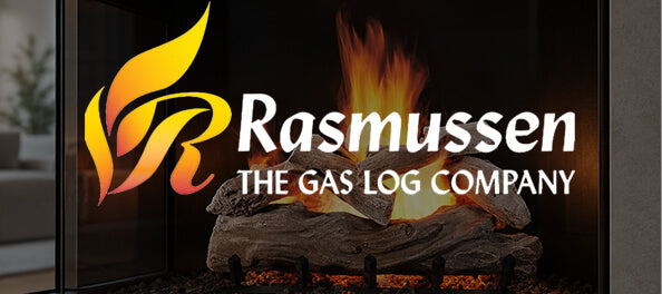 A gas log fireplace display with artificial logs and flames, featuring the Rasmussen brand logo and text 'RASMUSSEN THE GAS LOG COMPANY' overlaid on the front.